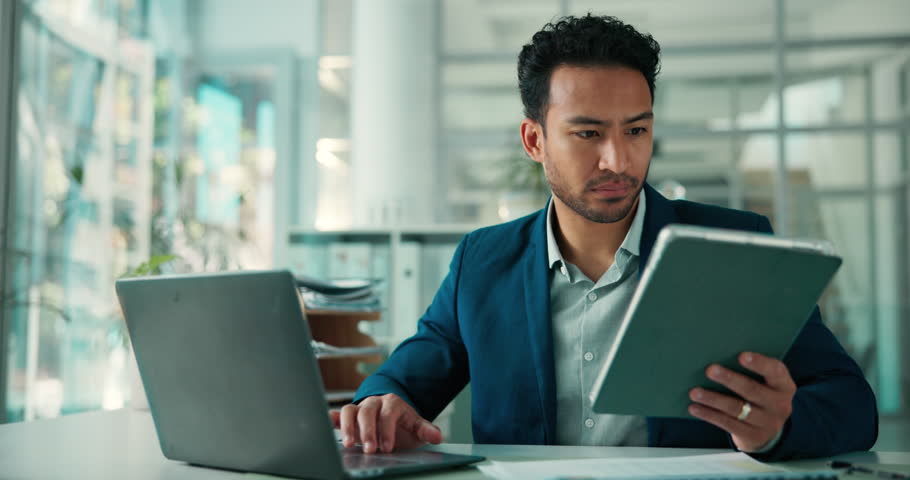 Laptop, tablet and reading with business man in office for broker email, account manager or research. Digital portfolio, investment advisor and online report with person in agency for risk assessment