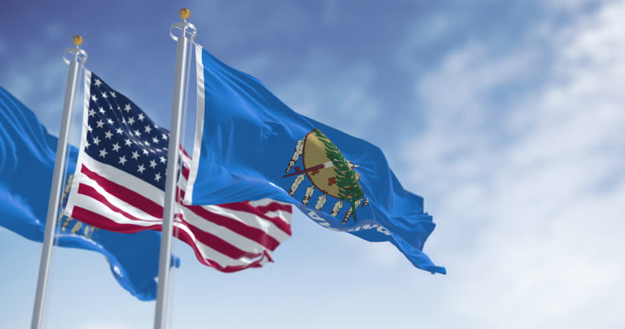 The Oklahoma state flag waving the american national flag. Oklahoma is a state in the South Central region of the United States. Seamless 3d render animation. Slow motion loop. Selective focus