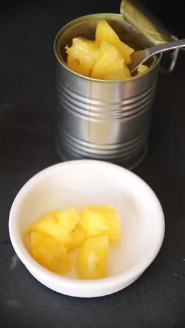 Pineapple canned food sweet fruit dessert tasty snack fresh gourmet food background on the table rustic top view copy space keto and paleo diet vegetarian and vegan food