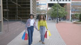 Excited African American women running with shopping bags - Powered by Shutterstock - Get 15% off with code: PIKWIZARD15