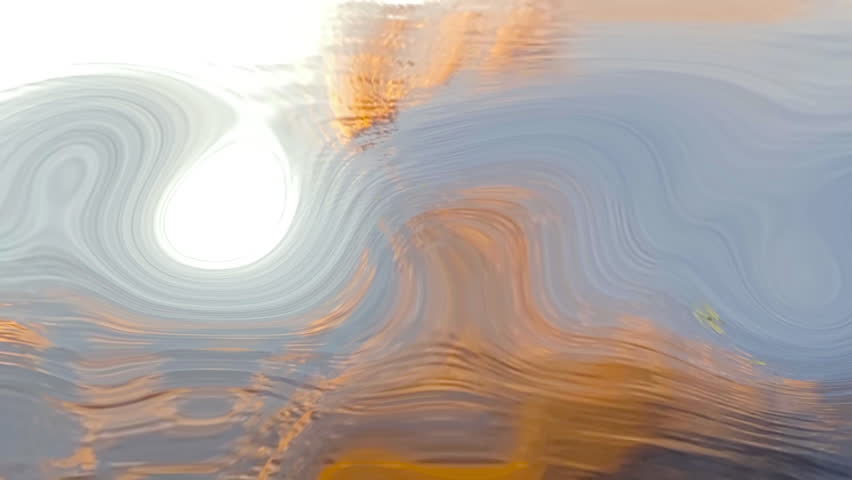 Artistic abstract image of swirling sunset colors reflected on water, with smooth waves and circular patterns creating a dreamy and fluid visual effect. Ideal for backgrounds and design projects