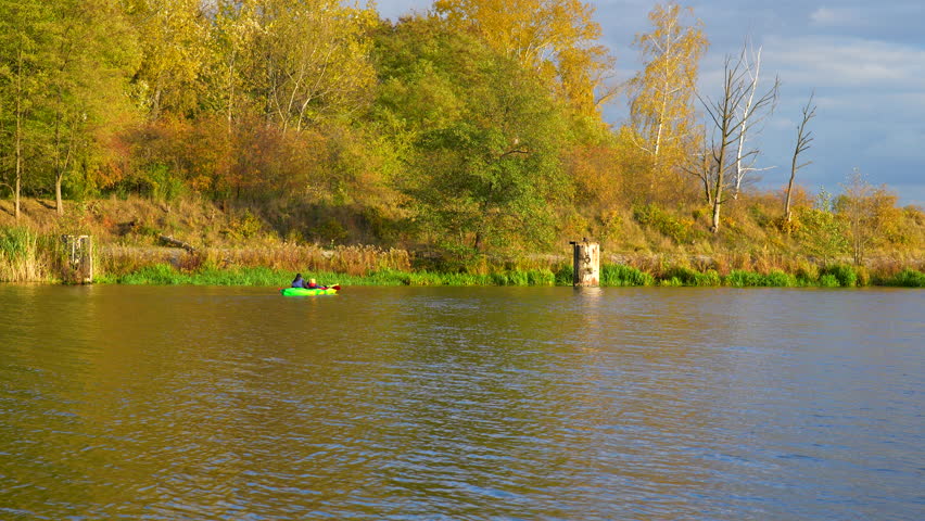 kayak on a river in a park in autumn