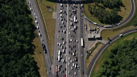Drone Moving above Crowded Highway Interchange Loops