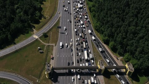 Drone Flying above Crowded Highway through Forest