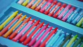 Variety of art supplies neatly organized in a blue case. Includes colored pencils, markers, and tools for creative projects. Bright, vibrant, and ready for drawing, crafting, or school activities. - Powered by Shutterstock - Get 15% off with code: PIKWIZARD15