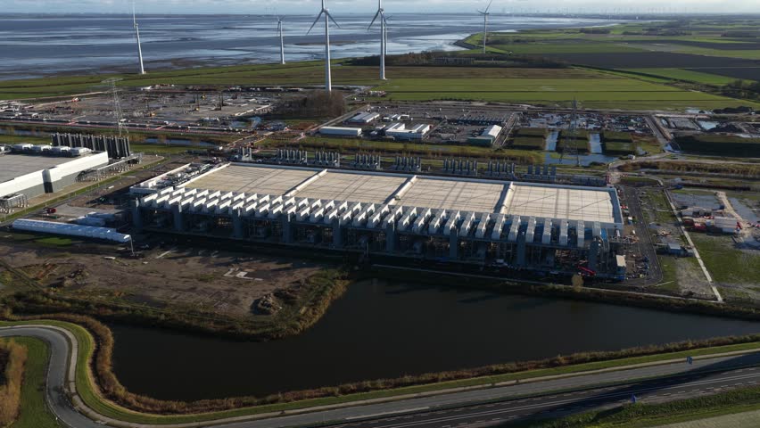 New build computing data center complex inthe Eemshaven, The Netherlands. Still under construction. - Powered by Shutterstock - Get 15% off with code: PIKWIZARD15