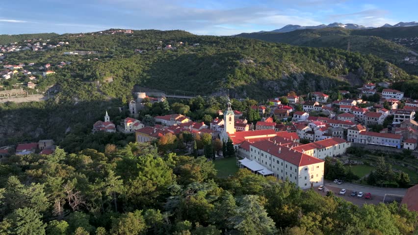 Rijeka, Croatia and Trsat Castle a part of Old City port at the river Rijecina firth. Aerial Shot at Summer Morning.