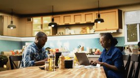 African American partners involved in a heated discussion about money. Surrounded by invoices and calculator, arguing about expenses, reflecting financial strain and relationship tension. Camera A. - Powered by Shutterstock - Get 15% off with code: PIKWIZARD15
