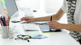 Designer switching mouse and stylus on desk, animating blue network icons while reviewing design. Workspace, tablet, pen, glasses, headphones, creative, digital - Powered by Shutterstock - Get 15% off with code: PIKWIZARD15