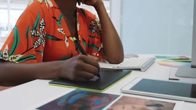 Woman editing with stylus on design tablet, UI appearing and multiplying guiding swatch consulting. Creativity, workstation, vibrant, colorful, colorwheel, palette, focus - Powered by Shutterstock - Get 15% off with code: PIKWIZARD15