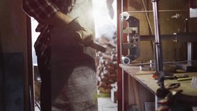 Craftsman adjusting clamp as network nodes fading in overlaying bench and showing woodworking data. Workshop, carpenter, wood, lumber, backlit, sunlight, tools - Powered by Shutterstock - Get 15% off with code: PIKWIZARD15