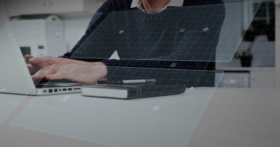 Tech pro resting hands on laptop and typing, activating rotating blue circular AR HUD overlays. Holographic, interface, notebook, pen, office, professional, concentration