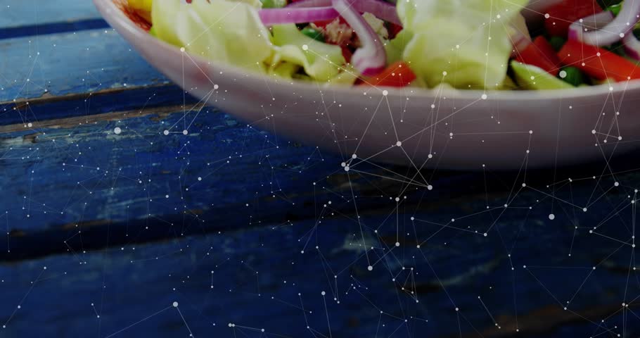 HUD overlays appearing, camera zooming and panning, graphics tracking salad details for promo. Greens, tuna, mozzarella, bowl, lettuce, onion, pepper