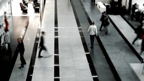 Abstract timelapse of blurred people walking through bright modern hall indoors suitable as concept for shopping mall metro airport or railway station traffic. - Powered by Shutterstock - Get 15% off with code: PIKWIZARD15