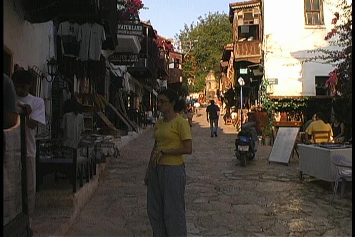 Tourists walking and browsing the shops in Kas, Turkey