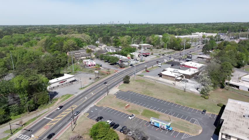 Flat Shoals Road green neighbourhood with Downtown Atlanta skyscraper in view at distance, Decatur city, Atlanta, Georgia, Drone
