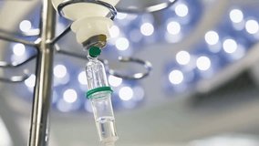 Close-up of an intravenous (IV) drip in an operating room, highlighting medical care, hospital treatment, patient support, and healthcare equipment. - Powered by Shutterstock - Get 15% off with code: PIKWIZARD15