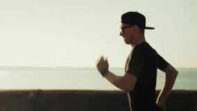 Runner Jogging Along Coastal Promenade At Sunset, Athlete Training On Seafront Road, Fitness Exercise And Endurance Sport, Healthy Lifestyle And Cardio Workout, Man Running. Summer Marathon Training - Powered by Shutterstock - Get 15% off with code: PIKWIZARD15