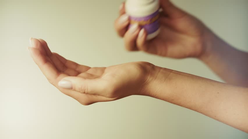 Dispensing Pills From Bottle Into Hand, Taking Daily Medication Or Supplements. Health And Wellness. Hands Holding Medical Tablets, Taking Prescription Drugs, Vitamin Dosage. Pharmaceutical Treatment