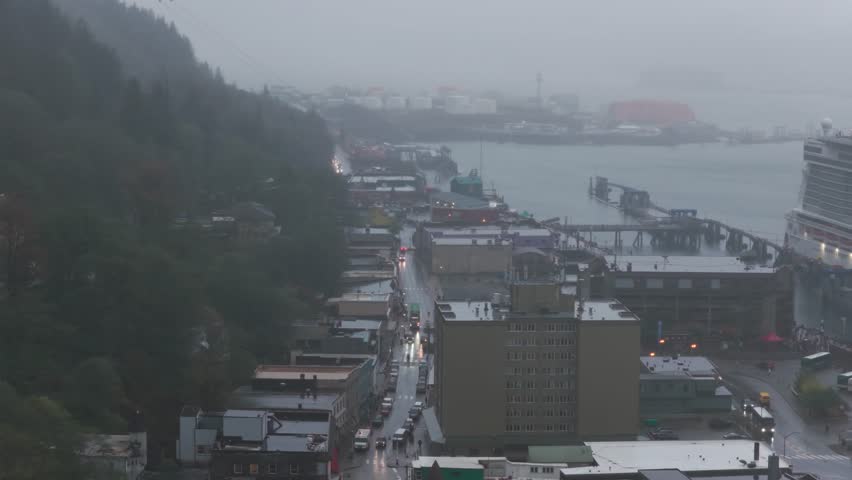 Telephoto panning aerial shot of the historic downtown district near the cruise terminal on a rainy fall day in Juneau, Alaska. 4K