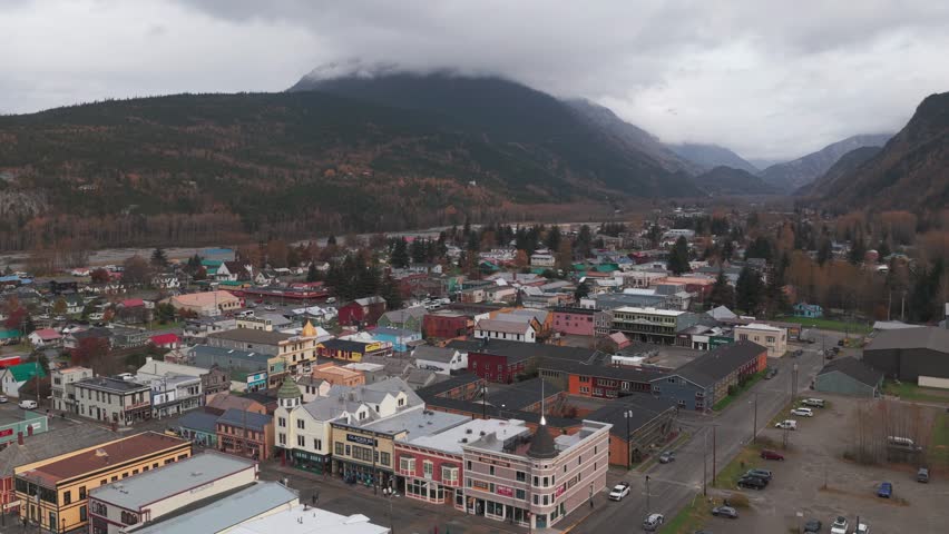Aerial rising and panning shot of the historic port town of Skagway, Alaska in early autumn. 4K