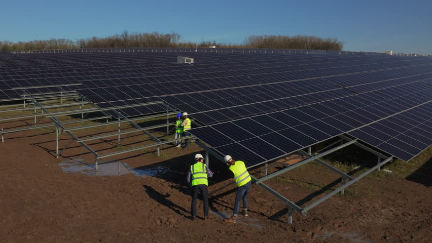 Solar panel installation at renewable energy site in open field