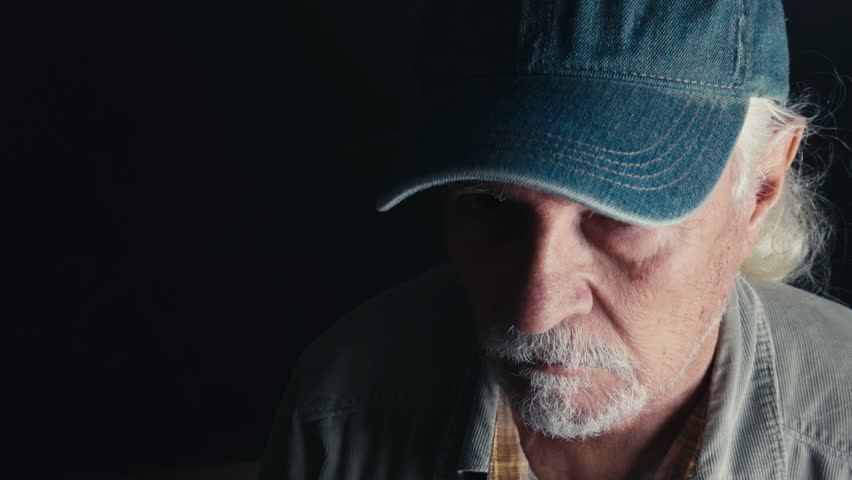 Old Man Makes Shut Up Warning Sign With His Finger