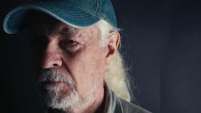 Old Man Makes Shut Up Warning Sign With His Finger