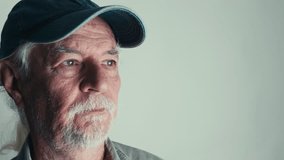 The Senior Old Man rubs his face with his hands in exhaustion - Powered by Shutterstock - Get 15% off with code: PIKWIZARD15