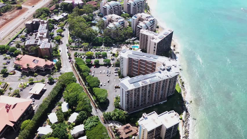 Hyperlapse shows Maui beachfront hotels and crowds, highway, then scorched desert