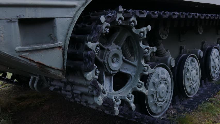 Close-up shot of a tank on an open field, perfect for military or historical concepts.