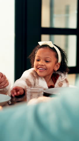 Lunch, thanksgiving and food with child in dining room for nutrition, bonding and festive gathering. Health, holiday season and smile with people eating in family home for reunion, relax and meal