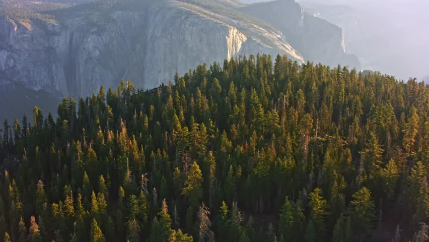 A stunning 4K video capturing a scenic view of the iconic landscape and towering granite formations of Yosemite National Park in the Sierra Nevada mountains of central California.