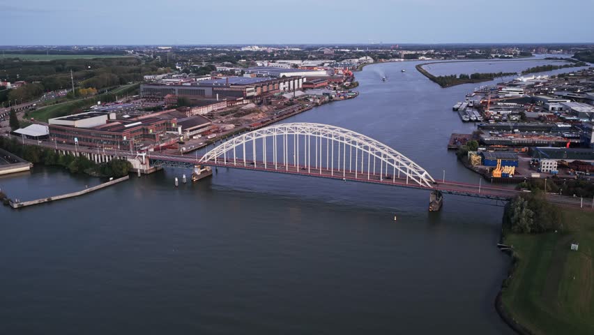 Aerial View of Industrial Bridge Over Water With Moving Traffic