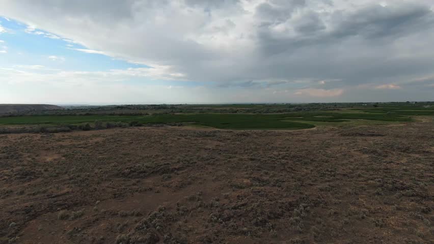 Drone view of desert cliffs and the Snake River close to Blue Heart Springs. Perfect for landscape, nature, and regional travel videos.