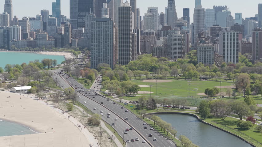 Downtown Chicago Skyline, Drone Shot of Central Skyscrapers and Lake Shore Drive Traffic, Illinois USA