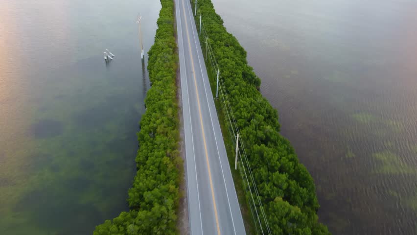 Aerial shot of the Sigsbee road leading to dredgers key in Key West florida. florida Keys 2025 drone shots flying over Sigsbee road and salt pond keys on the right side. morning sunrise view