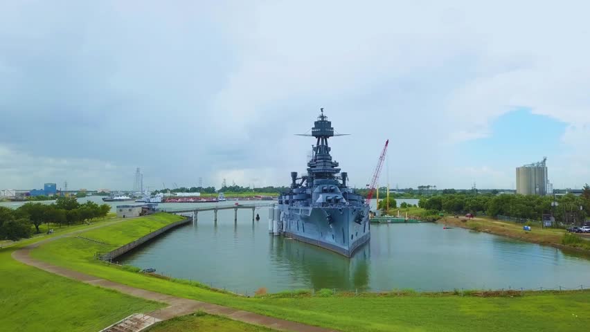 Historic USS Texas battleship docked at San Jacinto, Texas. Captures naval architecture, military history, and iconic Texan waterfront for tourism and educational visuals.