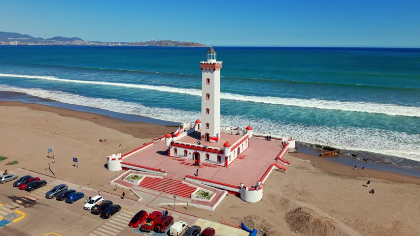 Aerial view of the Monumental Lighthouse of La Serena with Chilean flags and the Pacific Ocean in the background in northern Chile. - Powered by Shutterstock - Get 15% off with code: PIKWIZARD15