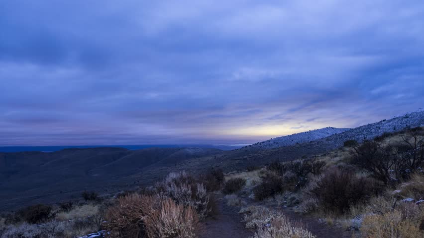 Time-lapse of rolling clouds and drifting fog over rugged high-desert slopes near the summit of Shaffer Mountain in Lassen County, California.