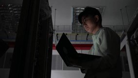 Computer engineer is setting up network in server room,Systems Maintenance Technician,Male engineer working in server room at modern data center - Powered by Shutterstock - Get 15% off with code: PIKWIZARD15