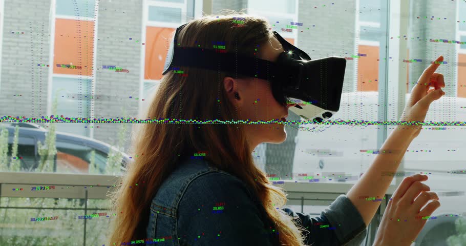 Particle field appearing near woman wearing VR headset by window hand shaping holo sphere for VR. Goggles, orb, glitch, glow, neon, urban, storefront