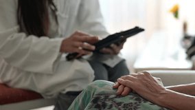 Doctor comforting elderly patient during home medical visit - Powered by Shutterstock - Get 15% off with code: PIKWIZARD15