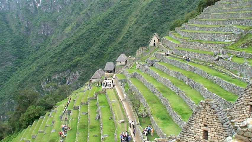 A stunning view of Machu Picchu’s ancient stone houses and terraced slopes in Peru, showcasing iconic Incan architecture, mountain scenery, and rich historical heritage.