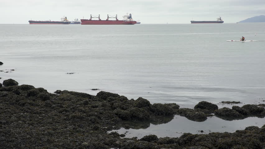 Paddling English Bay Vancouver 4K UHD.Paddling on a grey day on English Bay. Vancouver, British Columbia, Canada. 4K UHD
