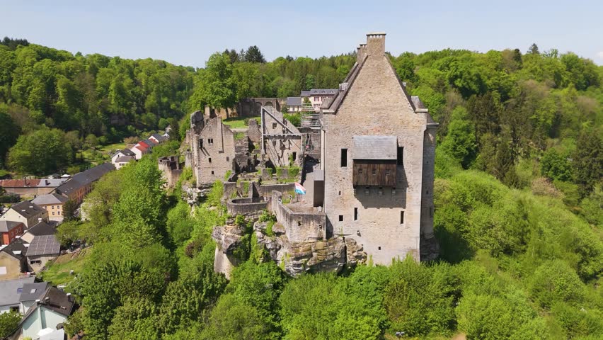 larochette castle green cover flag restoration progress old ruins visitors gardens hills behind beautiful town below luxembourg château fort de