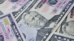Several 50 dollar bills placed in stack with portrait of Ulysses Grant on top. Legal tender used for payment of public and private debts in financial exchanges - Powered by Shutterstock - Get 15% off with code: PIKWIZARD15