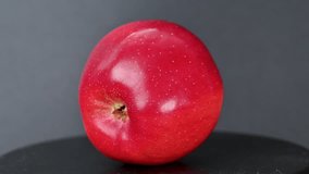 Video of a red apple on a black background - Powered by Shutterstock - Get 15% off with code: PIKWIZARD15