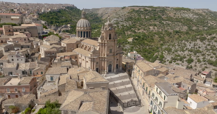 Aerial view of the Cathedral of San Giorgio, located in the historic center of Ragusa Ibla, Sicily, Italy. It is a Catholic church with a beautiful facade, an example of Baroque architecture.