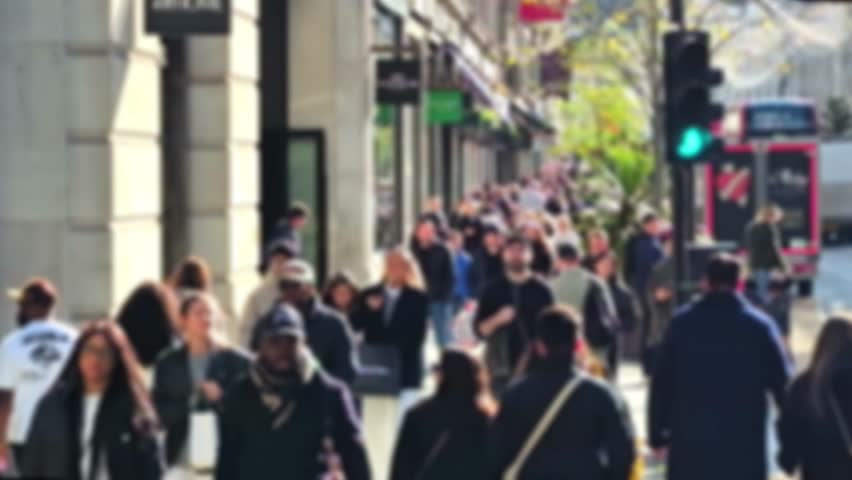 Blur on crowd of people walking in London, Regent street. 2025